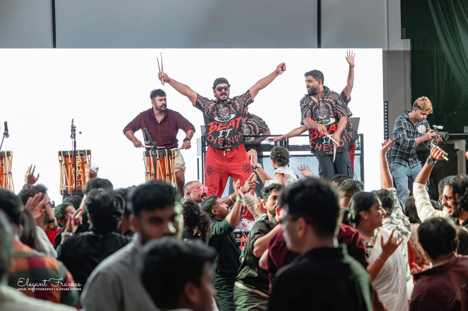 Chenda musicians leading the celebration as guests dance near the stage