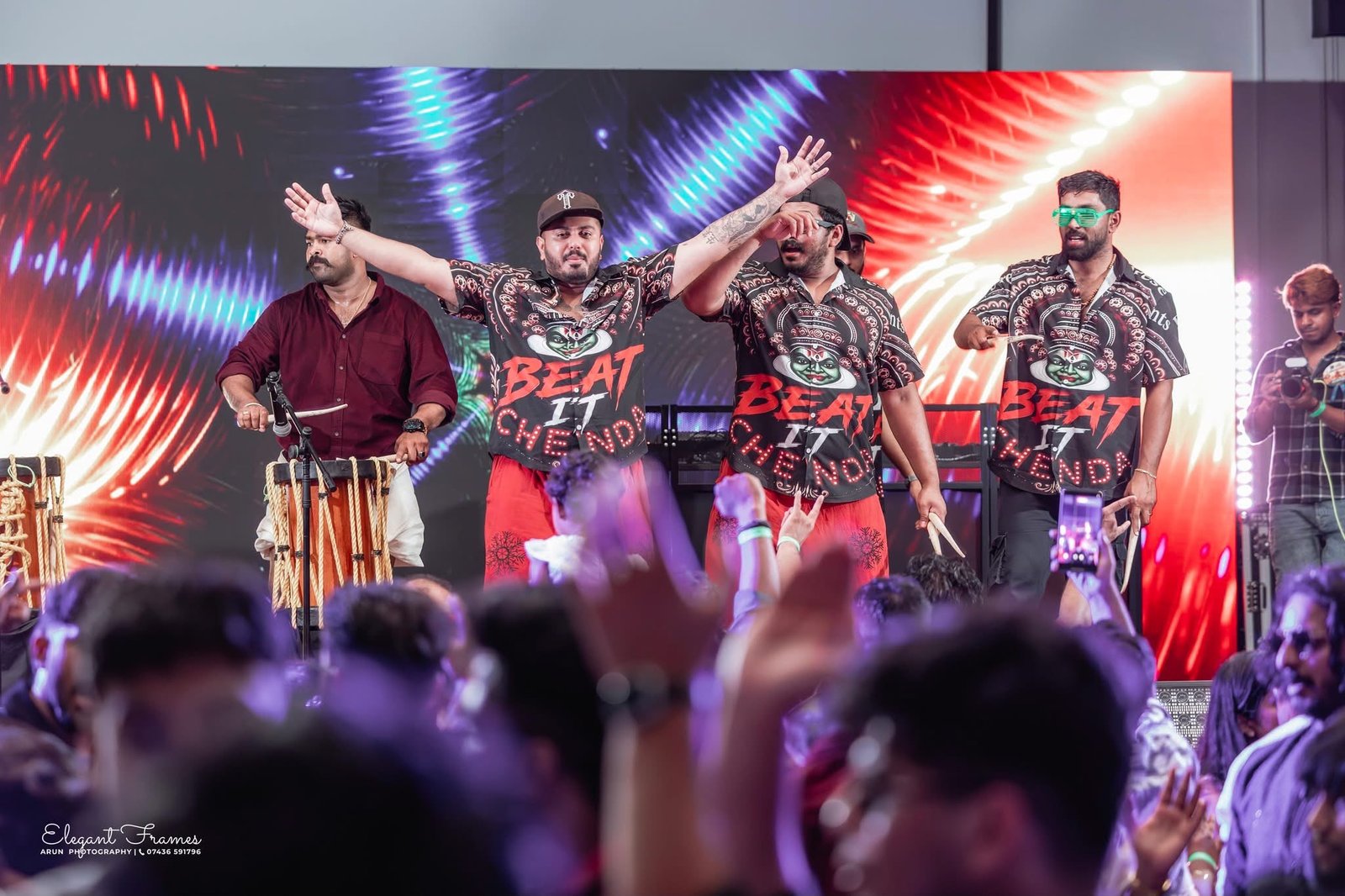 Beat It Chenda performers greeting the cheering crowd with arms outstretched